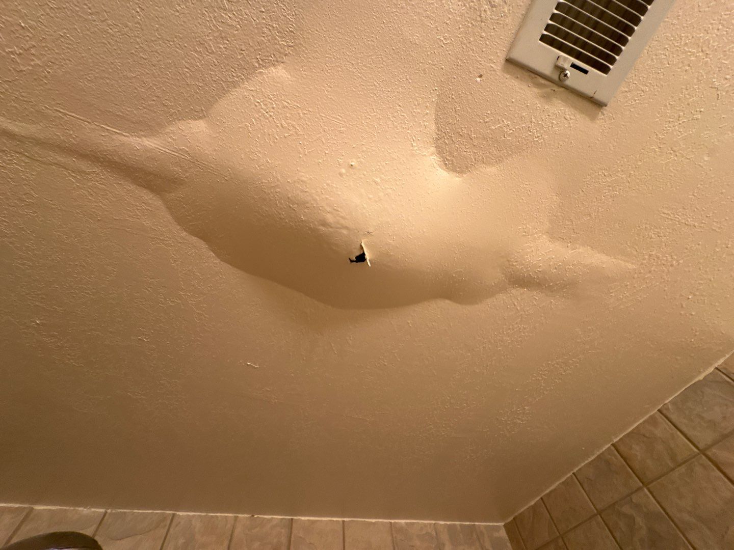 Water damage restoration professionals extracting water from a flooded property